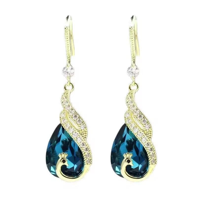 Boucles d'Oreilles "Goutte Royale" – Cristal Bleu Facetté et Cascades Dorées